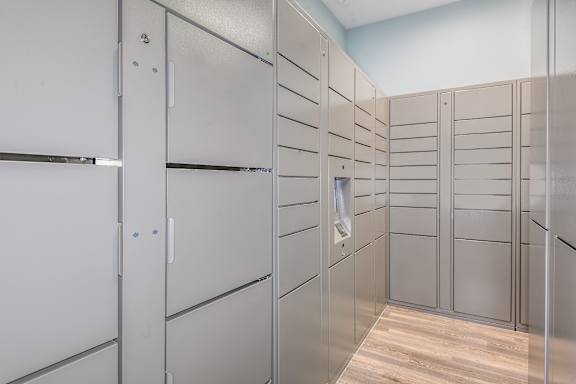 A row of white lockers in a room.