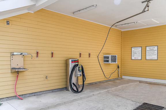 A yellow wall with a CAFE ChargePoint station.
