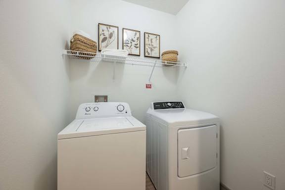 A laundry room with a washer and dryer.