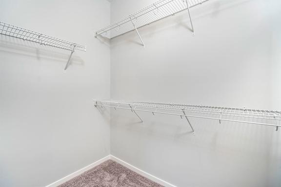 Empty shelves in a white room.