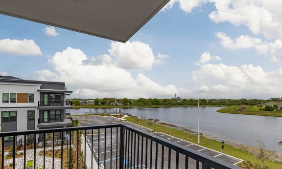 the view from the balcony of a condo overlooking the water