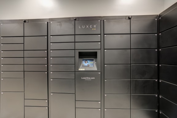 a lockers with a luzerne machine in the center of the room