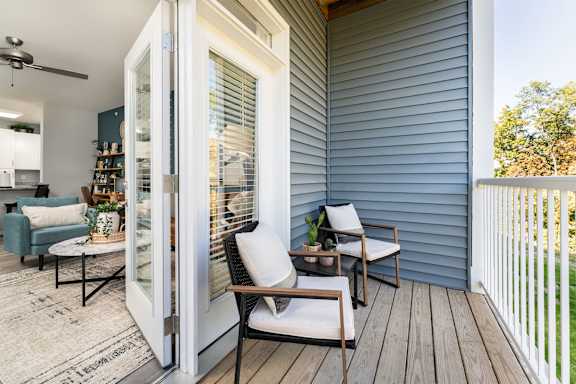A patio with a table and chairs is shown.