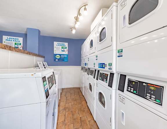 A row of washing machines in a laundromat