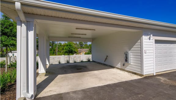 the garage of a home with a driveway and a white garage door at Altis Grand Lake Willis, Florida, 32821