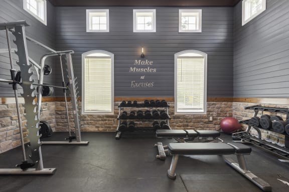 a home gym with a bench and exercise equipment