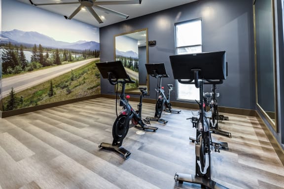 the residence apartments fitness room with exercise bikes