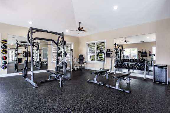 A spacious home gym with a variety of equipment.
