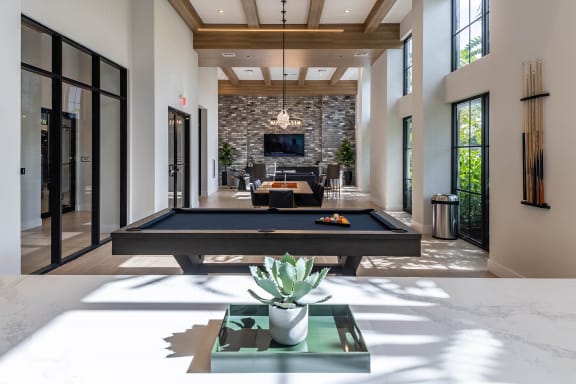 a large living room with a pool table and a television in the background at Leena Plantation, Florida, 33322