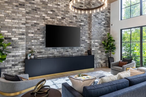 a living room filled with furniture and a large flat screen tv at Leena Plantation, Plantation, FL