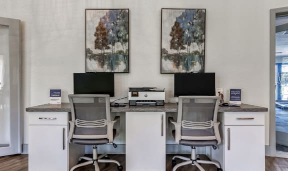 an office with three desks with computers and chairs at L'Estancia, Sarasota, 34231