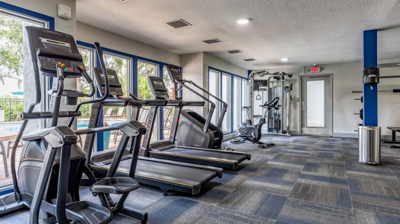 the gym with cardio equipment at the monarch luxury apartments in midtown at L'Estancia, Sarasota, 34231