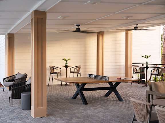 A patio with a table and chairs is shown.