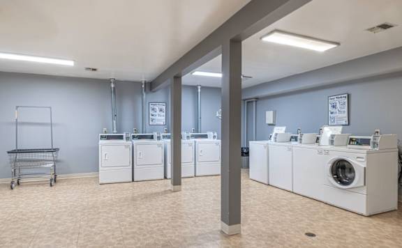 A laundry room with washers and dryers at Winchell Way Apartment , Kalamazoo, Michigan