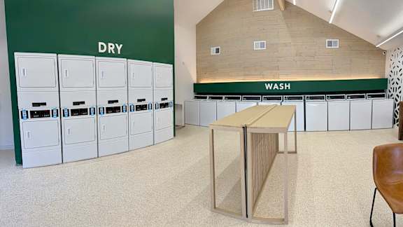 A laundry room with dry and wash sections.