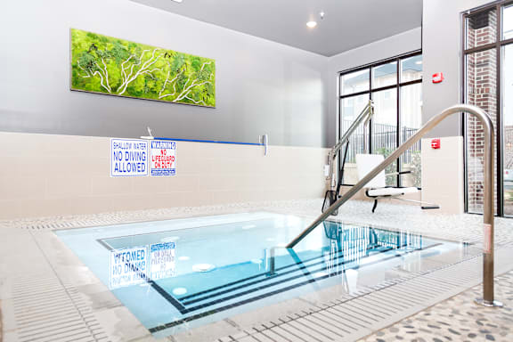 A pool with a sign that says "No Diving" on the wall.
