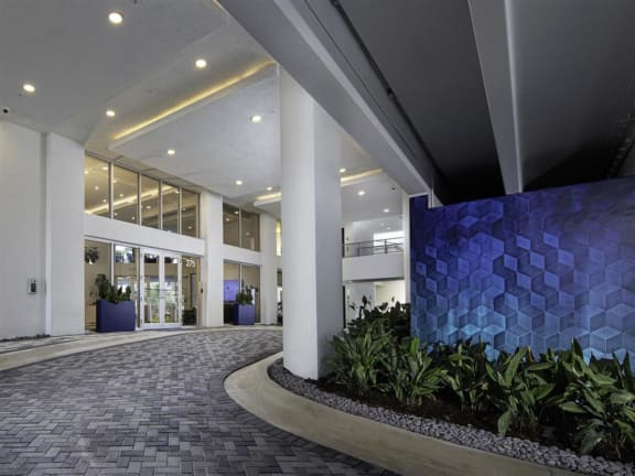 a large blue tile wall in the lobby of an office building at Saba Pompano Beach, Pompano Beach, 33062