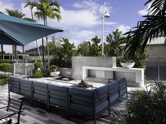 a patio with a fire pit and seating at Saba Pompano Beach, Pompano Beach, 33062