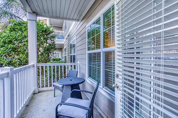 A patio with a table and chairs is shown.