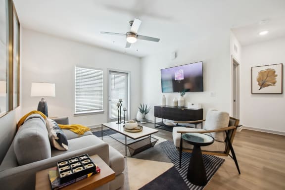 a living room with a couch and a tv