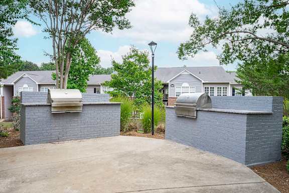 A row of houses with a street light in front.
