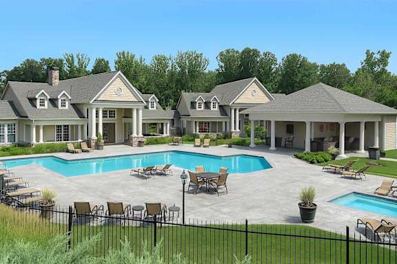 A large house with a pool in the backyard.