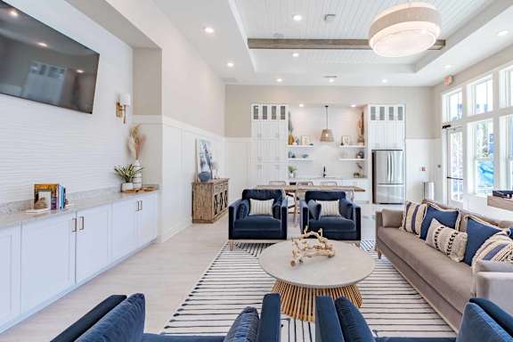 A living room with a white ceiling and a large window.