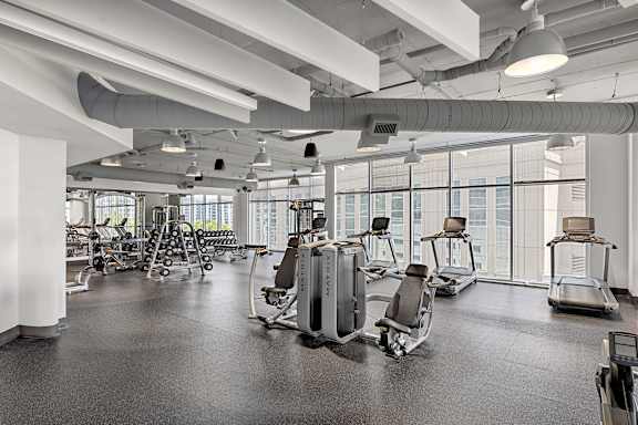 A gym with treadmills and exercise equipment.