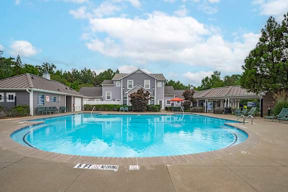A large outdoor swimming pool with the words "Bank of America" on the ground.