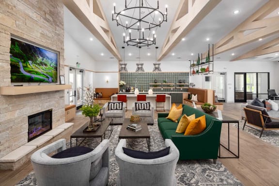 a living room with couches and chairs and a fireplace