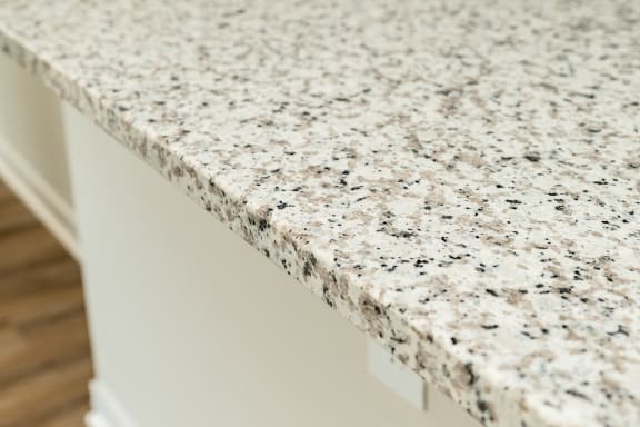 a close up of a granite counter top on a kitchen counter