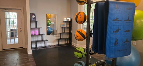 A room with a blue poster showing exercise instructions.