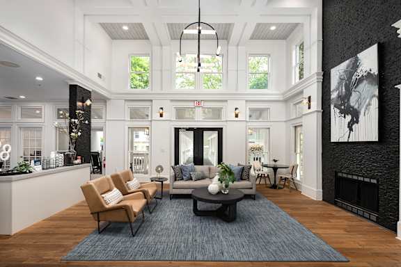 A modern living room with a fireplace and a large painting on the wall.