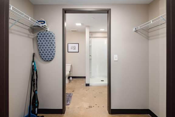 a large mirror in a walk in closet at Tower on Tenth Apartments, Alabama