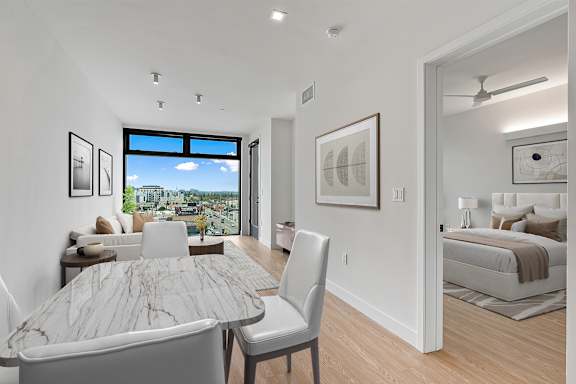 B3 - open dining and living area with floor to ceiling window