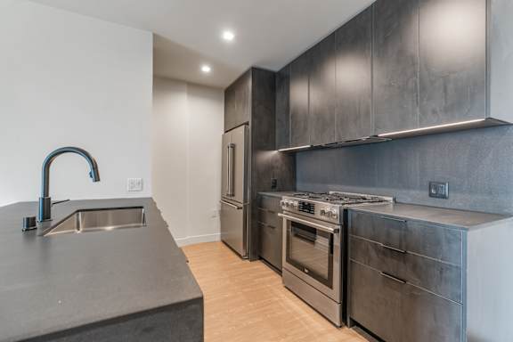 D - kitchen with dark finishes and peninsula countertop
