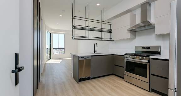 One Bedroom layout with open floor plan with suspended metal shelving