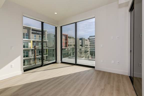 Master bedroom with dual balcony doors