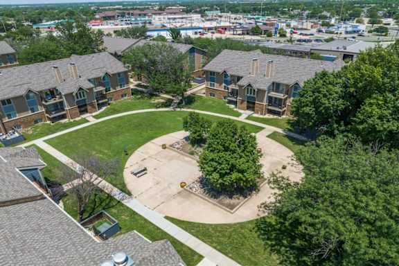 an aerial view of a neighborhood with houses and trees