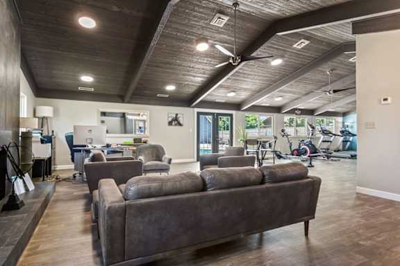 the preserve at ballantyne commons fitness room with couches and chairs