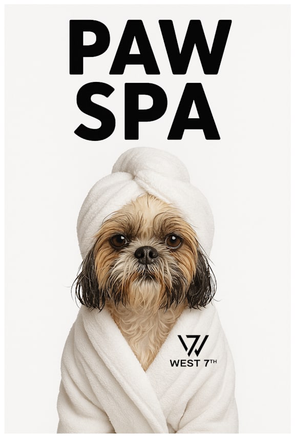A dog wrapped in a white towel with the words "PAW SPA" above it.