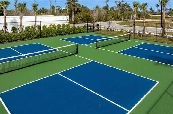 A tennis court with blue and green colors.