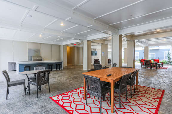 a large living room with a wooden table and chairs at The Flats at Summit Station, Pennsylvania, 15129