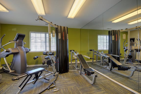 Fitness Center with Mirrors, Green Wall, Treadmills, Ellipticals, and Carpet at Rocklin Manor  Apartments, Rocklin  , CA