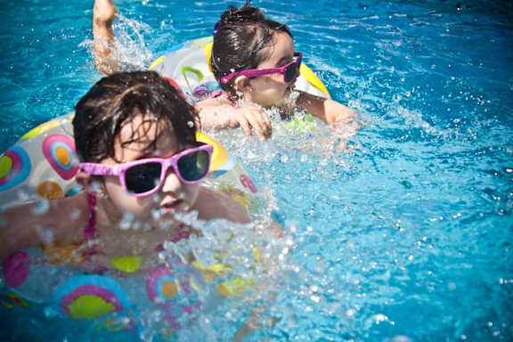 Kids Swimming in Pool at Maple Grove Rental Home Community in Lincoln, NE