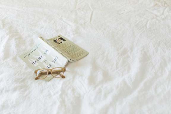 Book on Bed in Home at Maple Grove Rental Homes in Lincoln, NE