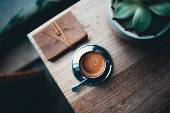 Journal With Coffee On Table at Patterson Place, Santa Barbara, California