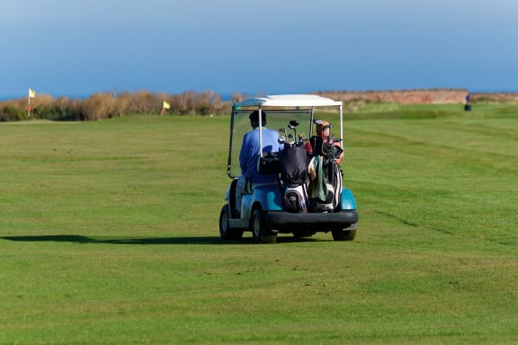 Golfers On Green Space at Rancho Franciscan Senior Apartments, Santa Barbara