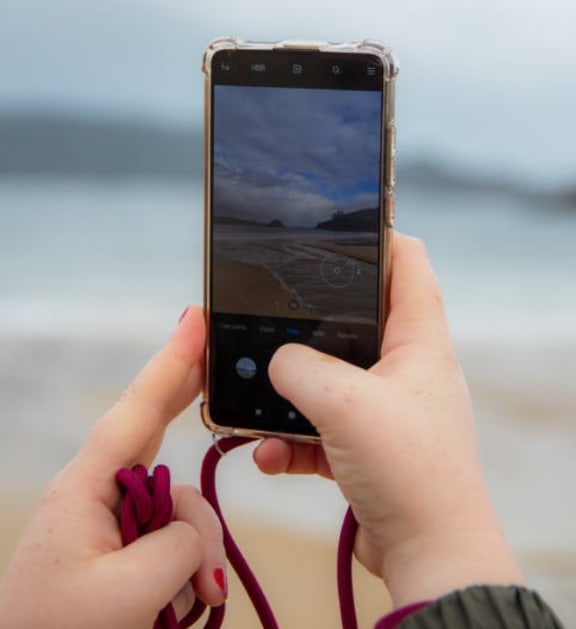 Clicking On A Phone at Cypress Meadows Senior Apartments, Ventura