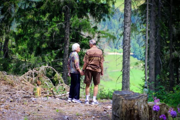 Couple walking at Cypress Meadows Senior Apartments, Ventura, California